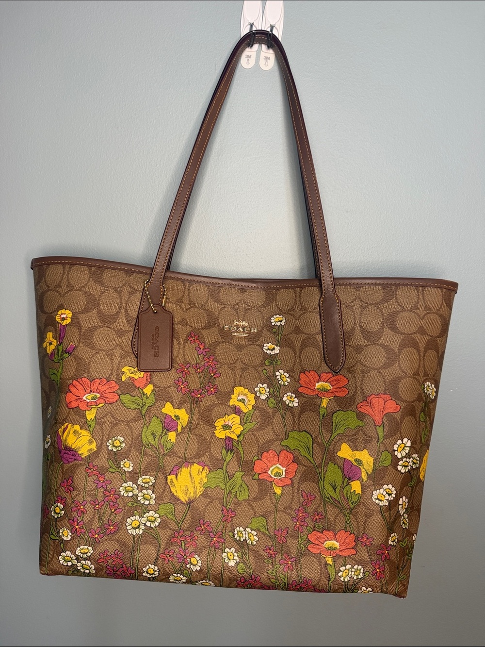 Coach Brown Signature Leather Tote with Floral Details, matching wallet